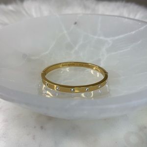 Kate Spade gold bezel set bangle.